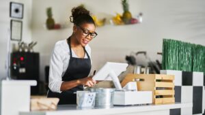 A woman operating a Retail Systems POS.